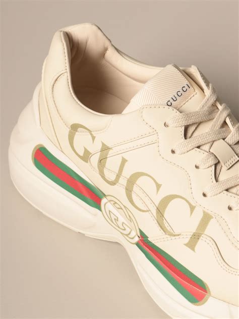 classic white gucci sneakers.